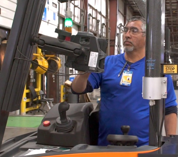 With a FoxBot, Walmart associate Jose Molina has three times the output than manual handling