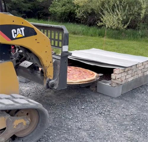 Forklift used as giant pizza placer