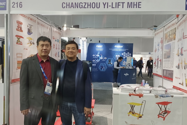 Yi-Lift Sales Manager Jack Jiang takes Patrick through their materials handling offerings.