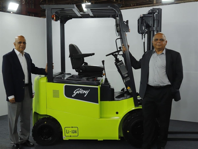 Directors Anil Verma and Anil Lingayat with Godrej & Boyce's new Li-ion forklift