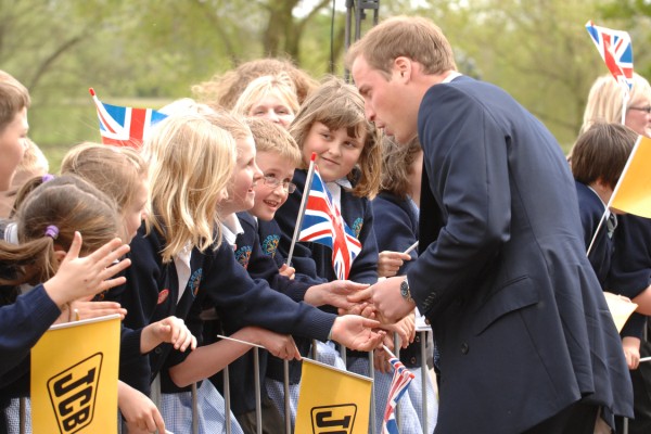 Prince William greeting school children at JCB's world headquarters in Rocester.