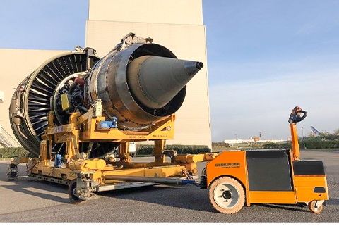 This is a tow tractor pulling a 20 ton engine from an Airbus A 380 between Hangar and testing area.