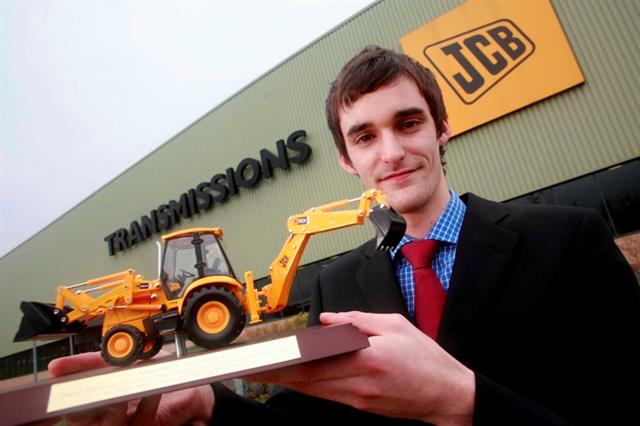 Paul Howard, JCB apprentice, with a specially engraved scale model of a JCB digger to mark his success in the Modern Apprentice competition.