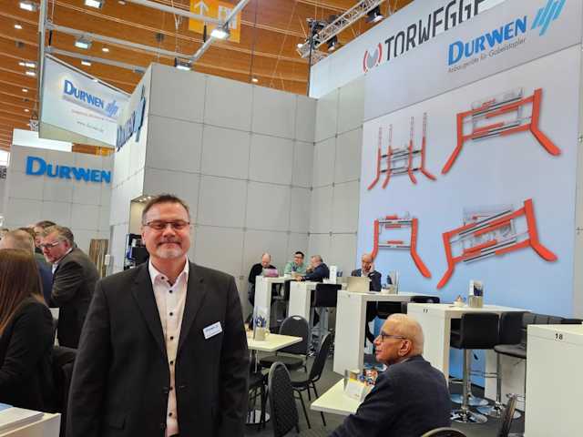 Durwen's head of export Ralf Taubenheim is ready to talk attachments, including their Multi Pallet Handler with camera and laser technology!