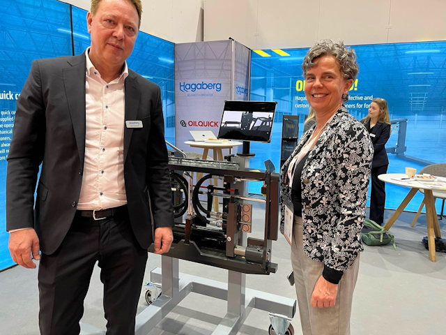 Stefan Carlsson, Pautt business development manager at Hagaberg, takes Ann through their latest offering, the Automatic Quick Coupler System.