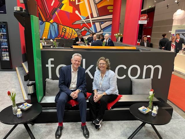 Angie and VETTER CEO Arnold Vetter take a load off atop a giant fork.