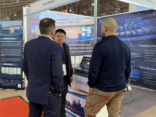 CEO Henry Peng discusses the Wellwit offering with a couple of visitors.