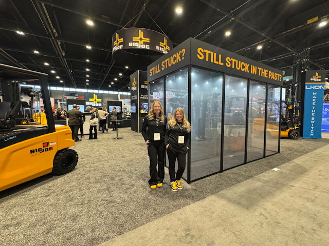 Amber Schmechel and Alyssa Stephens invite you into the future at the Big Joe stand. They are on hand to showcase the company's integrated lithium-ion forklifts and energy storage solutions.
