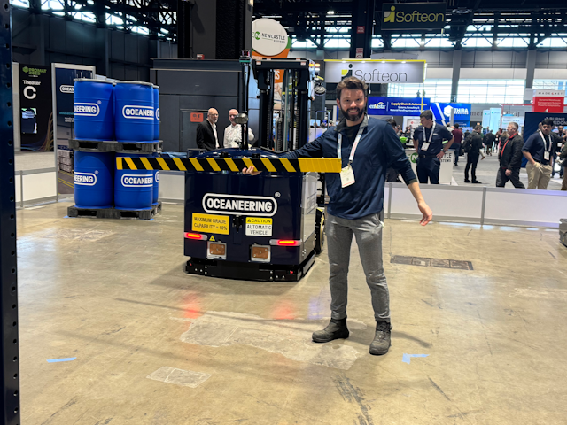 Joe Hoffsommer having some fun at the Oceaneering Mobile Robotics stand. Behind him their MaxMover™ CB D 2000 counterbalance forklift patiently waits to get through.