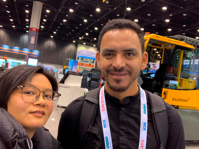 Jojo from construction machinery, and materials handling seating manufacturer Benfeng Seats, talks with a visitor about their latest offerings.