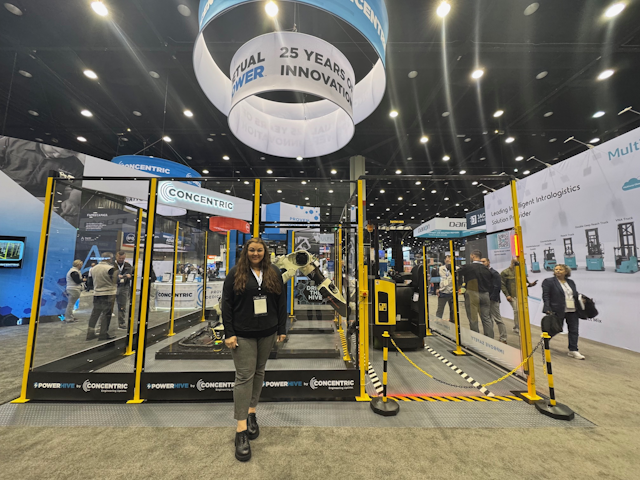 There’s a lot going on at the Concentric stand. Amy stands in front of demonstrations of the breadth of their power and maintenance solutions for forklifts, automation, and critical infrastructure.