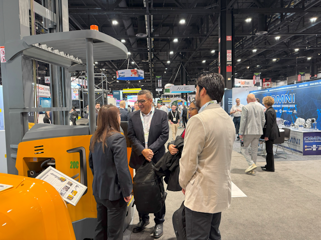 A friendly Xilin team member takes visitors through their range of warehouse equipment.