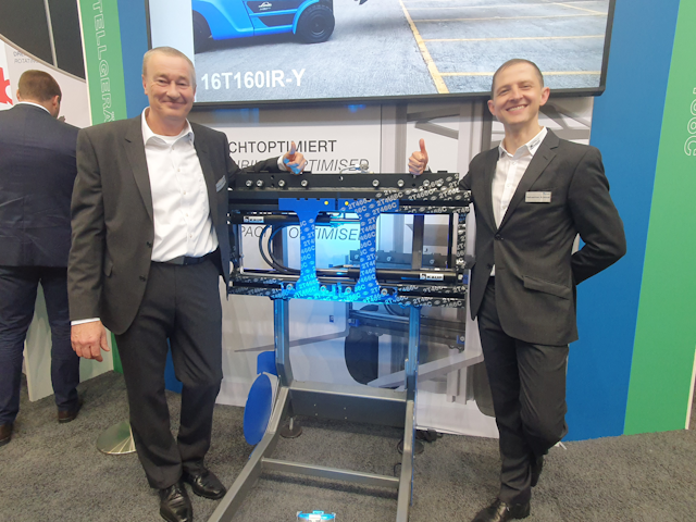 A lovely photo of Kaup's Gerald Schmitt and Sebastian Künzel showing off their Fork Positioner T466C.