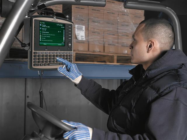 A forklift-mounted terminal in action