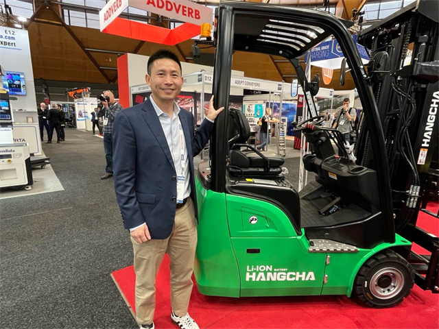 Leon Luo, GM at Hangcha Australia, shows off one of the nine electric and lithium forklifts that they brought to CeMAT Australia.