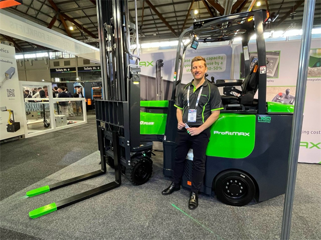 Over at the Pride Forklifts stand, Nick Lowe stands proud in front of the ProfitMAX Narrow Aisle Reach Truck.