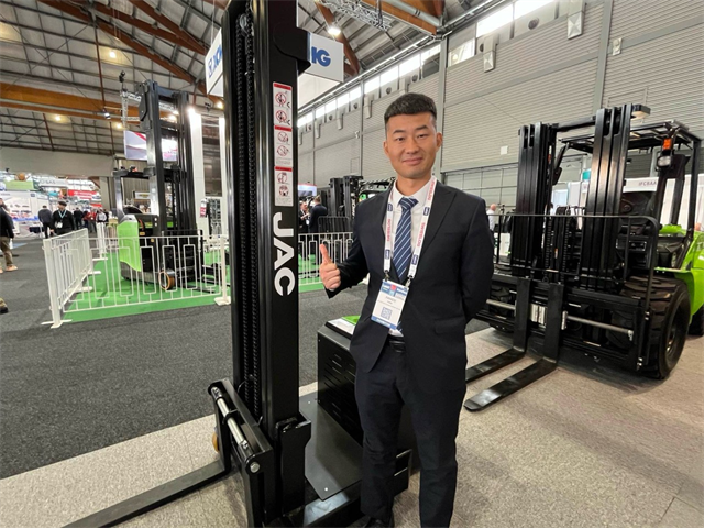 JAC Forklift’s sales manager Robin Han shows off their range on Day 2 of CeMAT Australia.