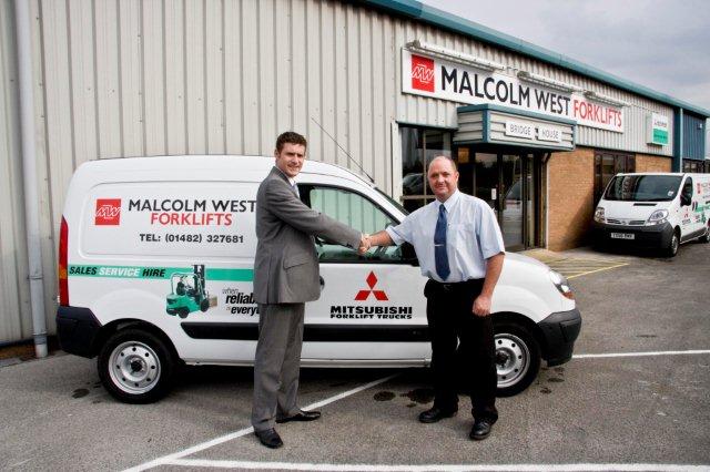 Mike Jones, general manager of Mitsubishi Forklift Trucks, and Nick West, managing director of Malcolm West