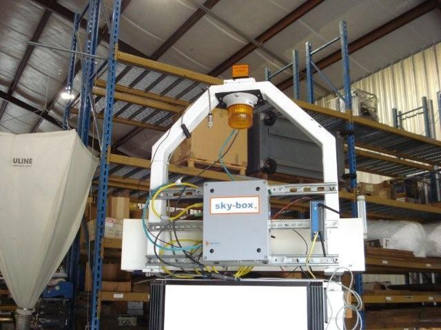 Sky-Trax Optical Position Sensor (orange box) mounted on a demo AGV together with a temporarily installed Sky-Box controller