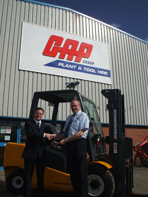 David Totten, branch manager of GAP's Anniesland facility, takes delivery of his new forklifts from Jungheinrich UK Ltd's John Cavanagh.