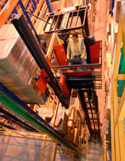 A Linde very narrow-aisle forklift working at Davies Turner.