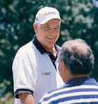 Ritchie Bros founder Dave Ritchie talking to a customer.