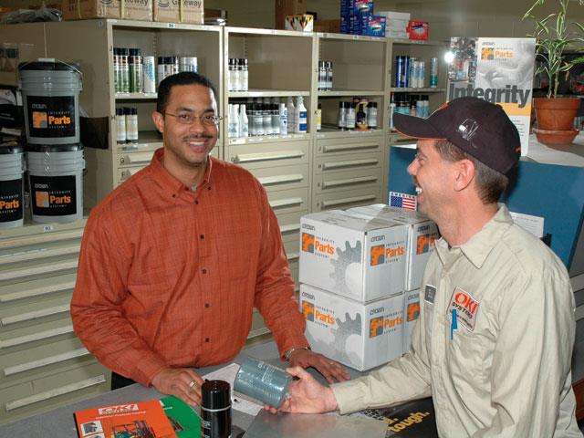 OKI employees processing a parts order.