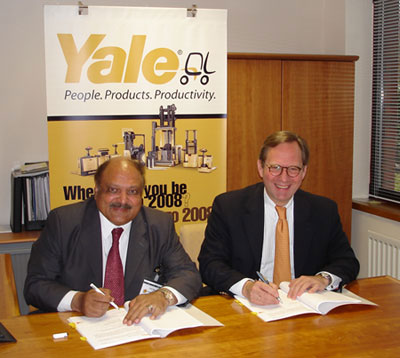 Mehmud Saeed and Ralf Mock signing the Yale Dealer agreement for Pakistan.