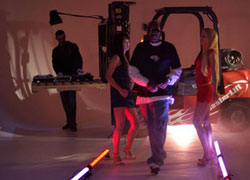 Choclair takes the stage with models in rehearsals for his cross-country tour. A deejay spins out beats with turntables on the forks of the customised forklift.
