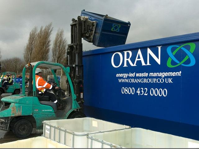 A Mitsubishi forklift working at Oran's material recycling facility.