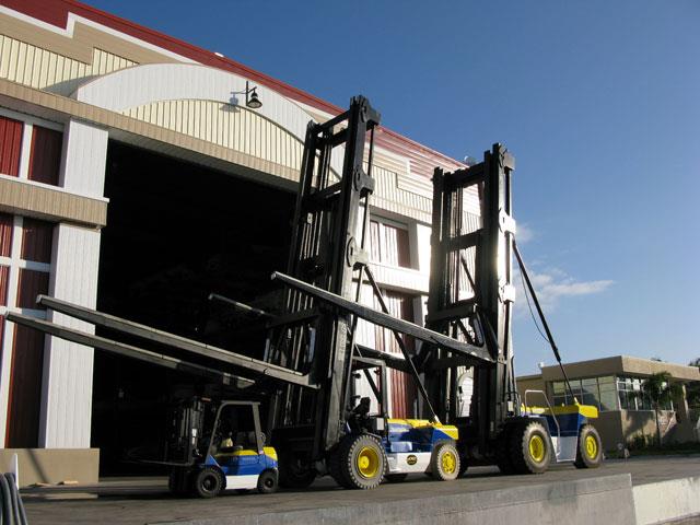 Hoist's M250 and M520 Neptune Series forklifts line up with a counterbalanced forklift.