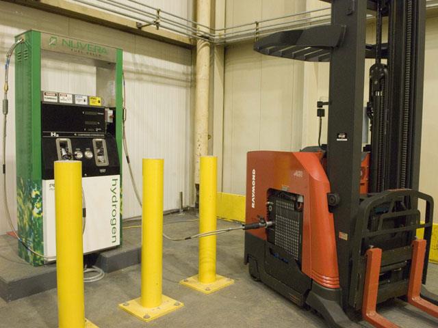 A fuel cell-powered Raymond reach truck being refuelled.