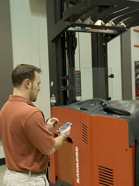 A technician accessing a technical publication via his handheld computer.