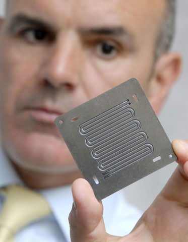 Bac2's technical director Graham Murray holds bipolar plate made from ElectroPhen