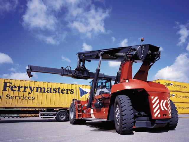 A Kalmar reach stacker handling containers.