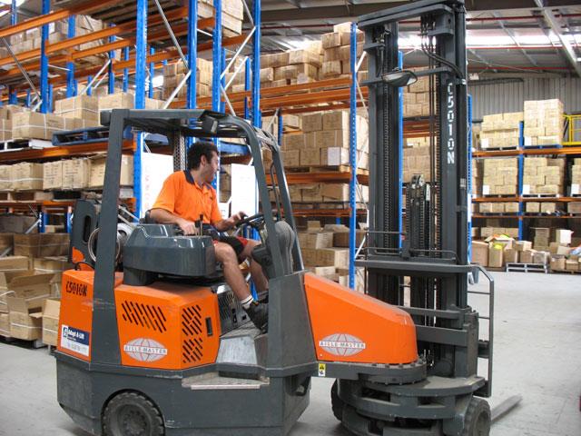 The Aisle-Master operating at Comfort Uniforms' warehouse.