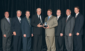 Jim Wingate (L) and Jeff Sell (R) receive awards on behalf of Lift Stak & Stor.