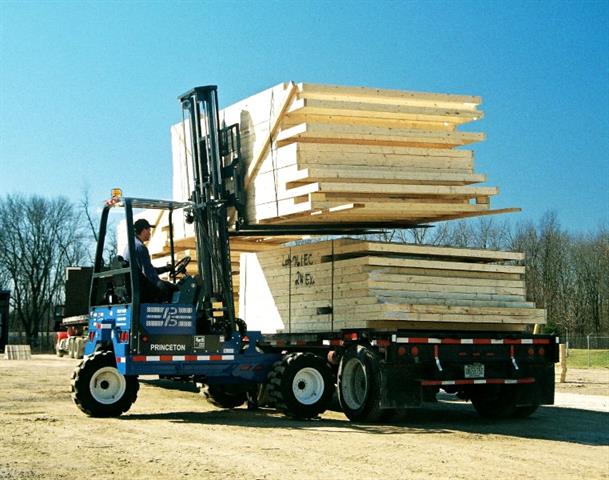 Princeton Piggy Back PB70 unloading wall panels at typical construction site.