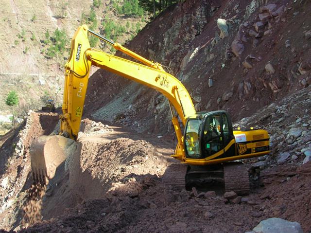 A 20 tonne JCB JS200 tracked excavator at work at a landslide site in the Pakistani province of Muzaffarabad.