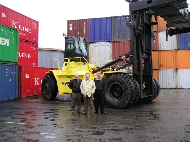 Randy Ferrario, centre, with Wajax Hyster sales manager Val Wright and sales representative Curtis Kostyniuk.