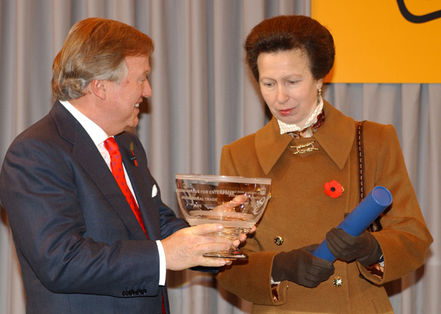 JCB Chairman Sir Anthony Bamford receives the Queen's Award from HRH The Princess Royal.