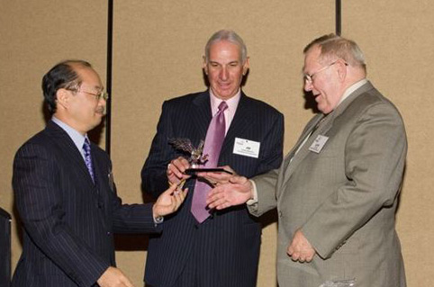 Larry A Borre (right) receives his ITA meritorious service award from