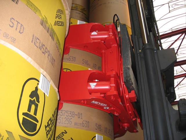 The 180 degree rotating paper roll clamp.