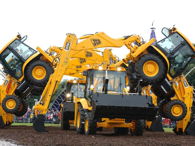 The JCB Dancing Diggers take a bow at JCB's diamond jubilee open day.