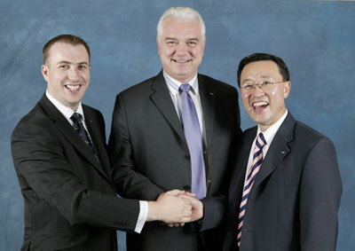 Derek Martin, centre, with Doosan Infracore's Kun H Lee and Paul Watson