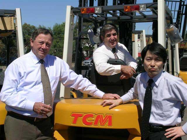 TCM's Hiroshi Narukawa (right) and NTP Forklifts Australia directors John Naffine (left) and Nick Perdelis (seated in forklift) during Mr Narukawa's Australia visit.