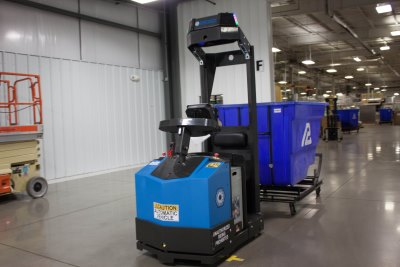 Packaging firm uses automated tow tractor for long-haul trash removal. Photo: Seegrid Corp