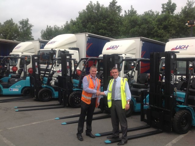 Clive Morrison (right), Director of Neckar Forklifts, hands over the new Baoli forklifts to Paul Westcott, Logistics Manager from UCH. Click for larger image