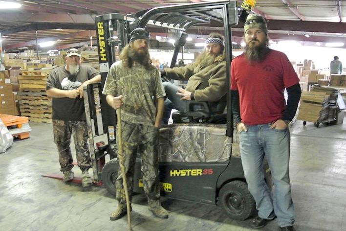 From left, John Godwin, Willie Robertson, Jase Robertson and Justin Martin with Duck Commander's Hyster J35XN forklift