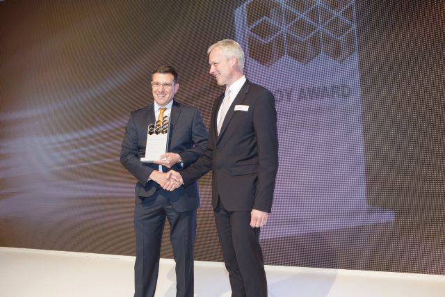 Ken Dufford, vice president of Crown Europe (left) receiving the award.